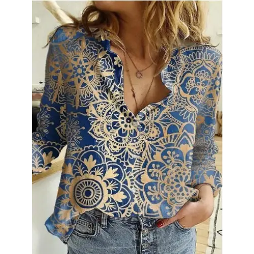 Blue and gold patterned blouse.