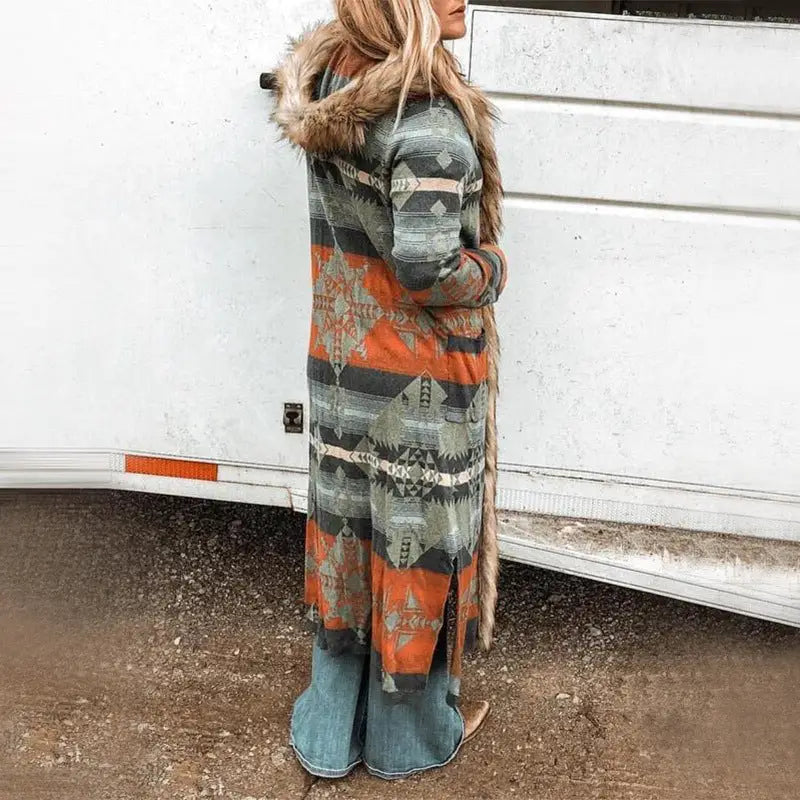 Long patterned hooded cardigan with fur trim.
