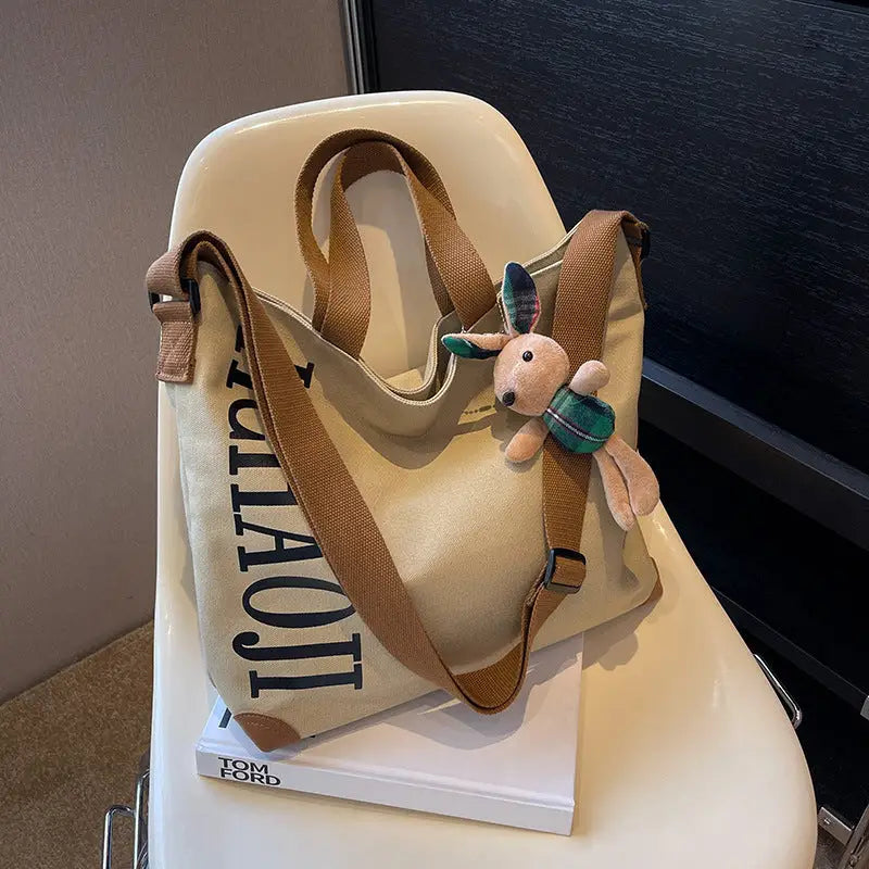 Canvas Shoulder Bag with Pendant and Ribbon Options - Beige
