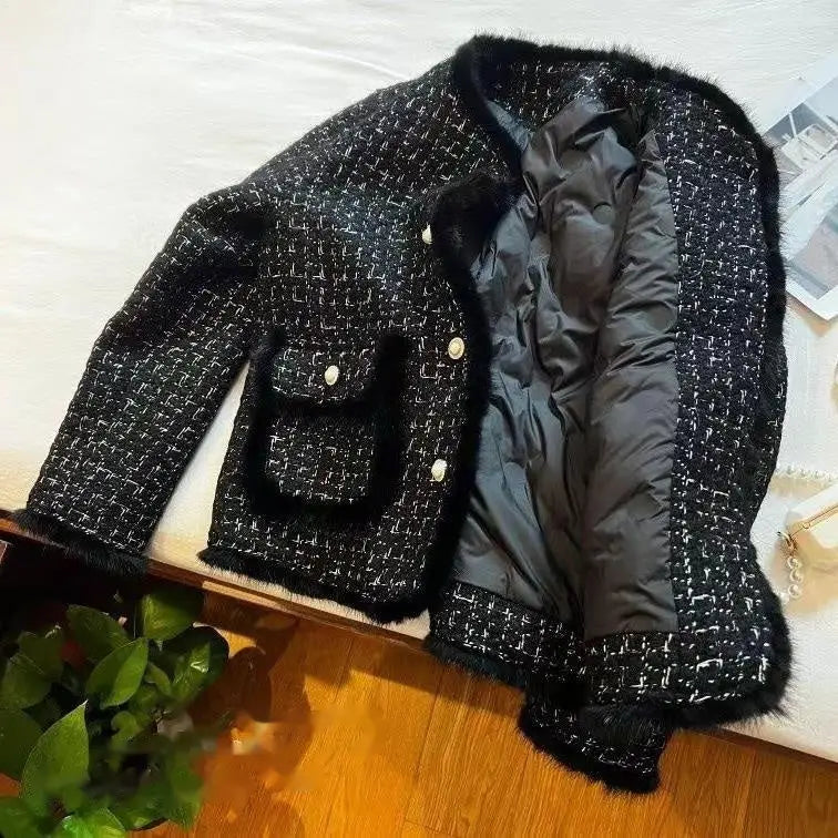 Black and white tweed jacket with fur trim.