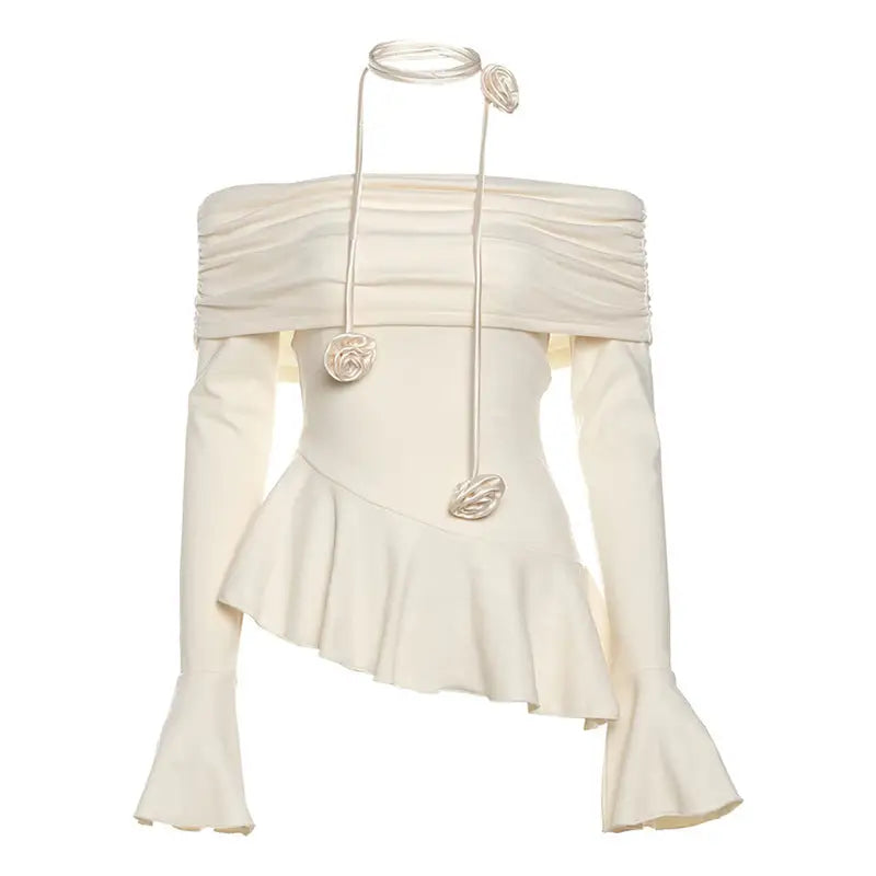 Off-the-shoulder ivory blouse with long sleeves and floral tie.