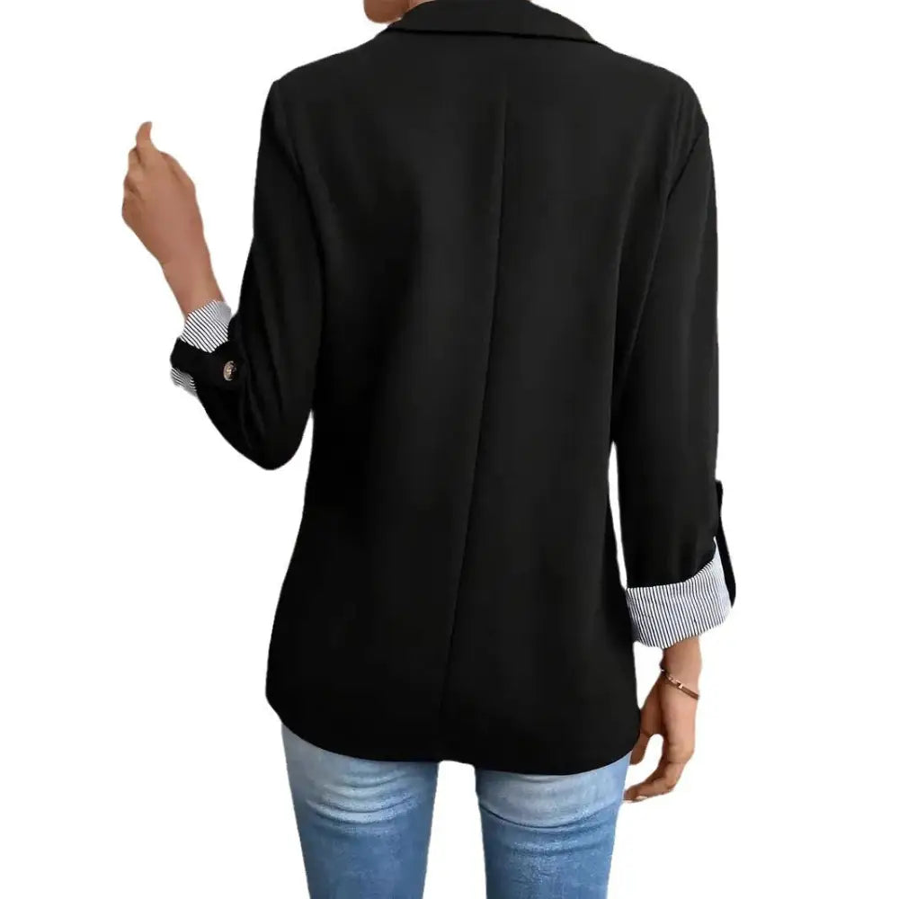 Black blazer with rolled-up sleeves.