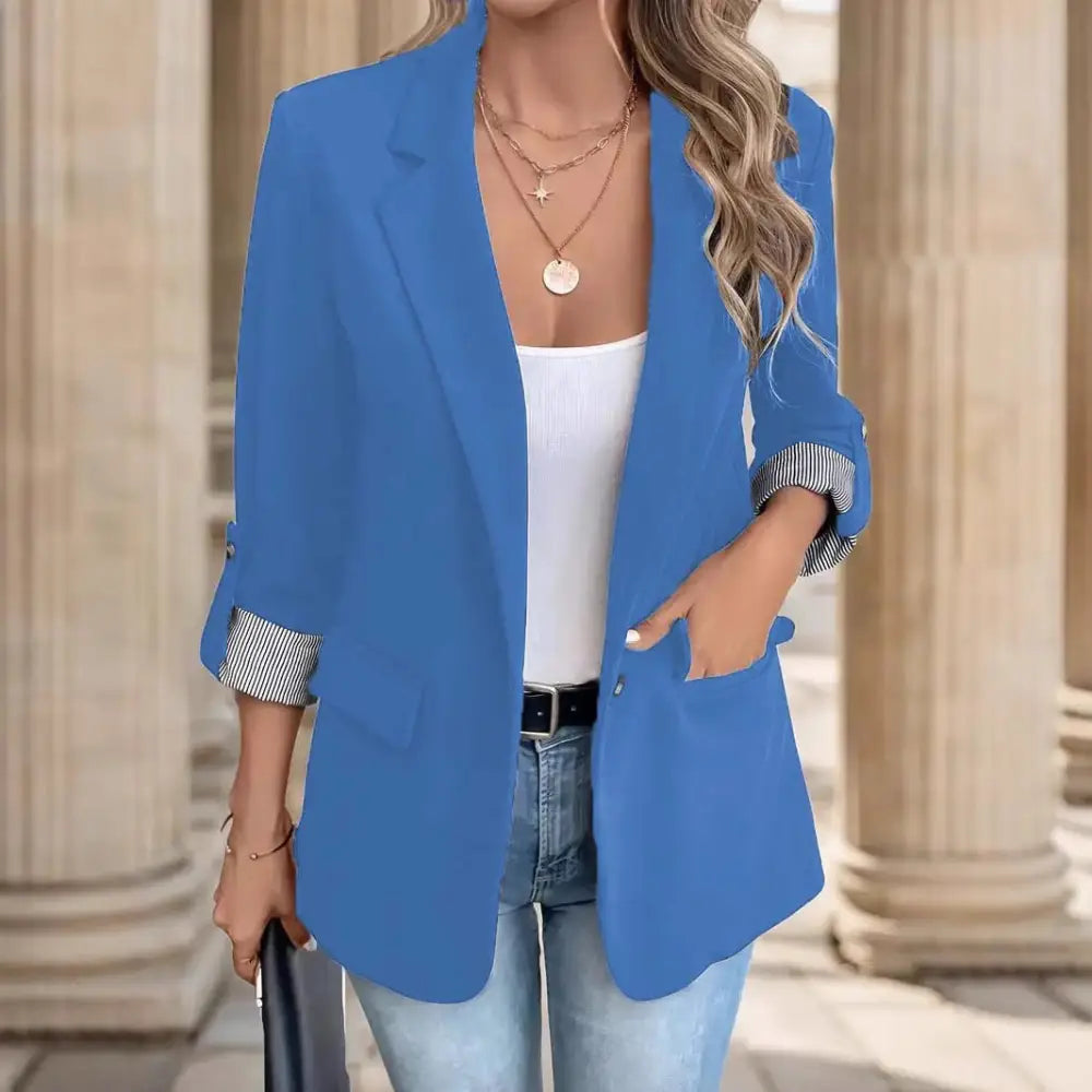 Blue blazer with rolled-up sleeves.