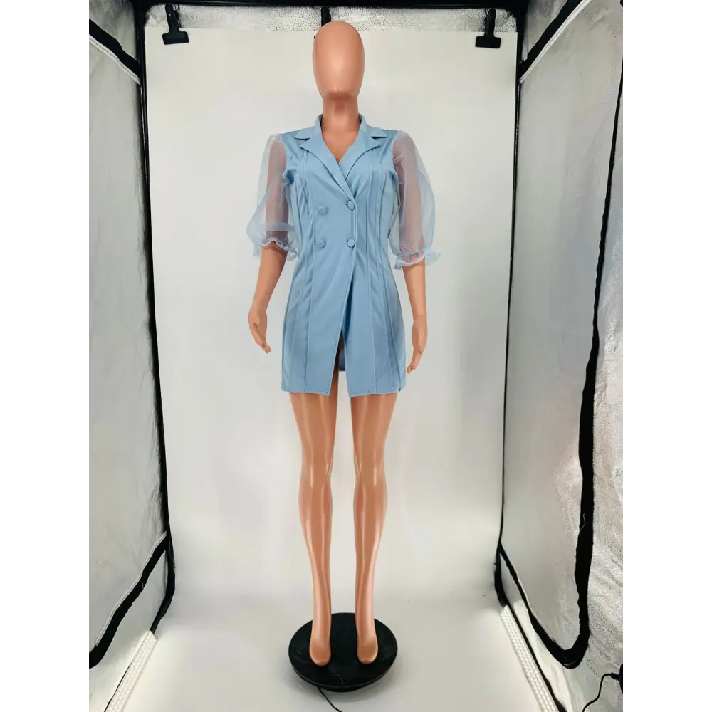 Light blue blazer dress with sheer sleeves.