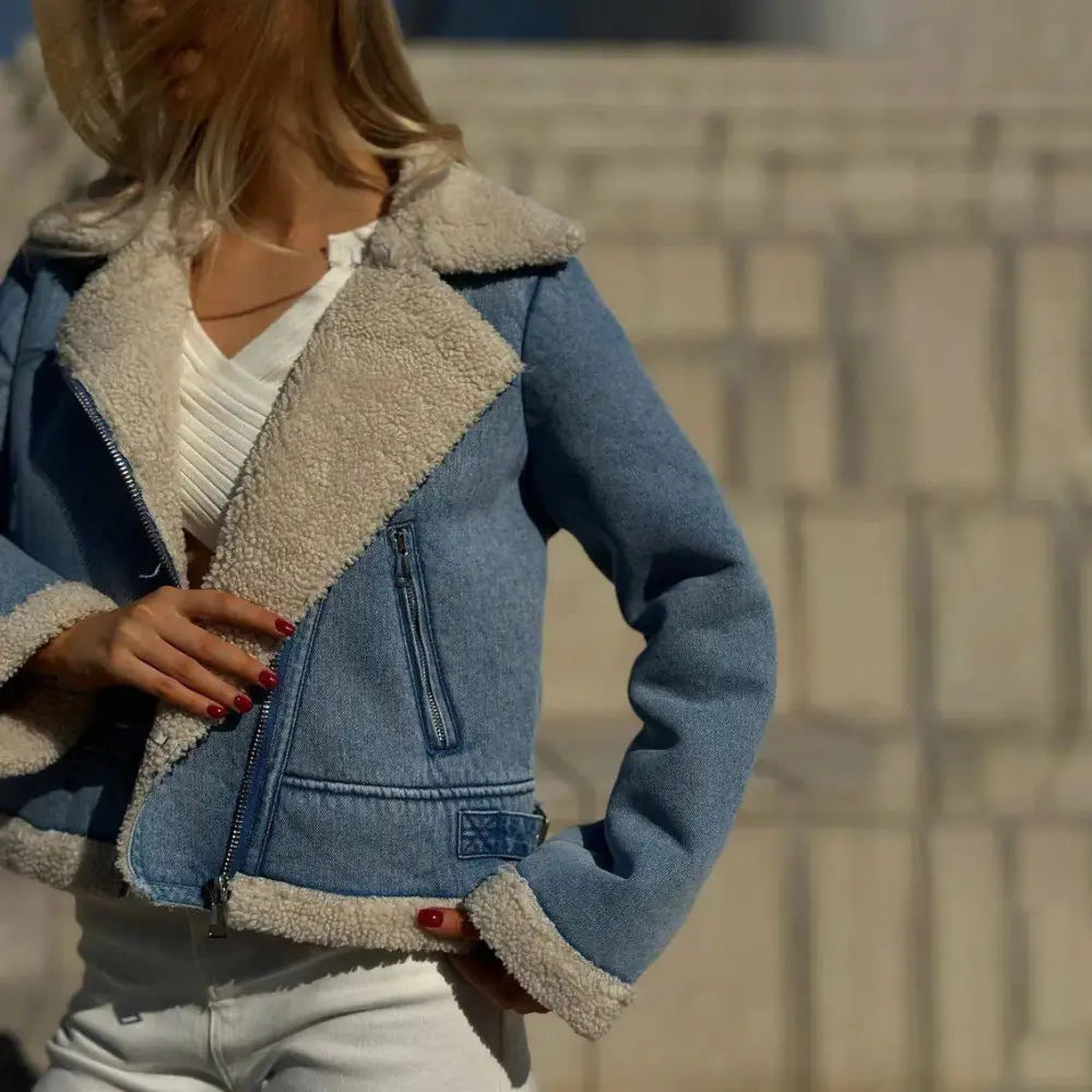 Denim jacket with faux fur trim.