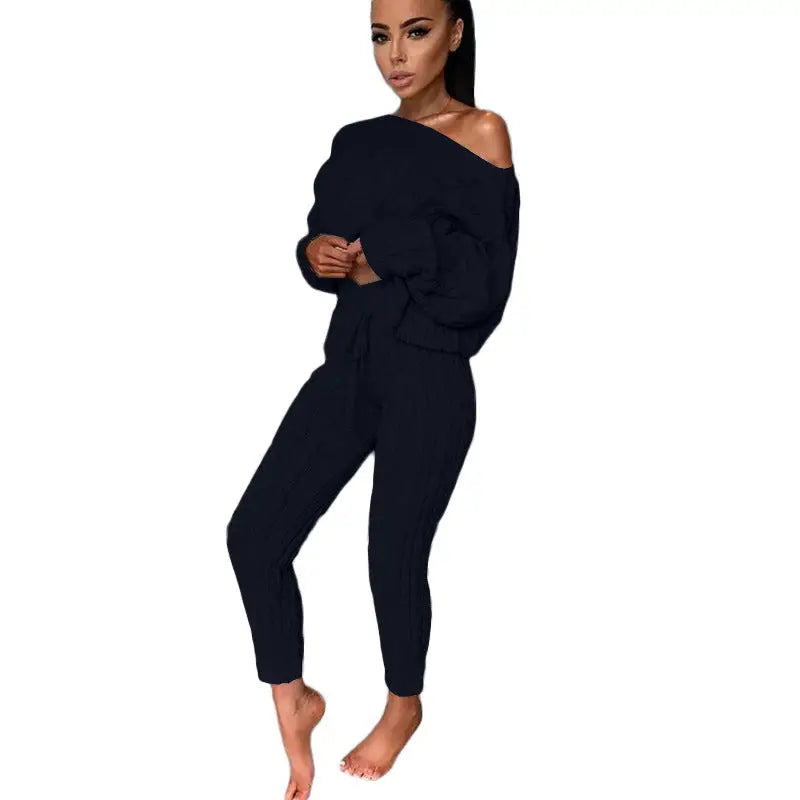 Woman in a dark two-piece outfit.
