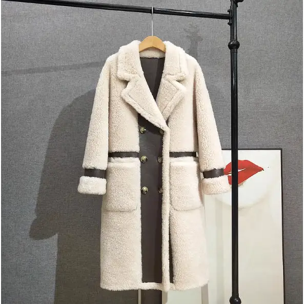 Cream-colored shearling coat with leather accents.