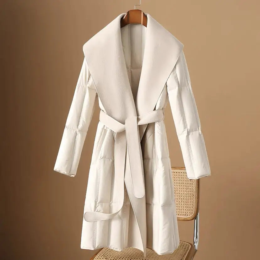 Cream-colored belted puffer coat.