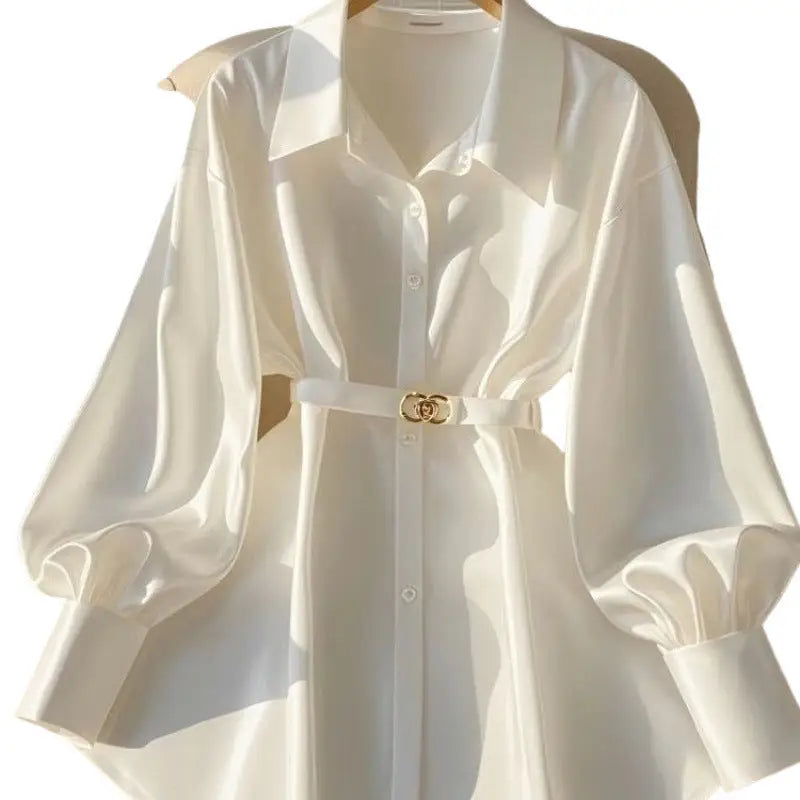White belted blouse with balloon sleeves.