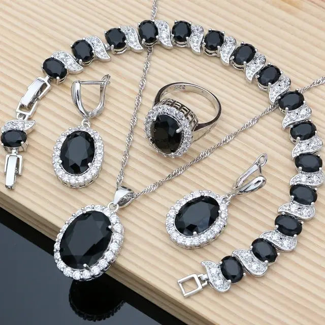 Silver jewelry set with black stones.