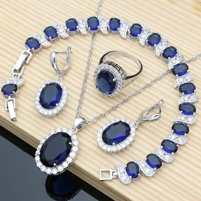 Silver jewelry set with blue stones.