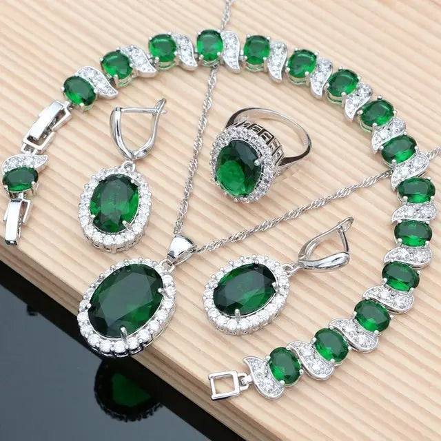 Emerald and silver jewelry set.