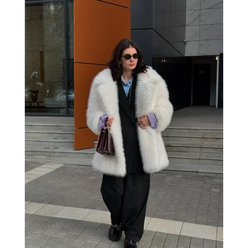 Woman in a fluffy white coat.