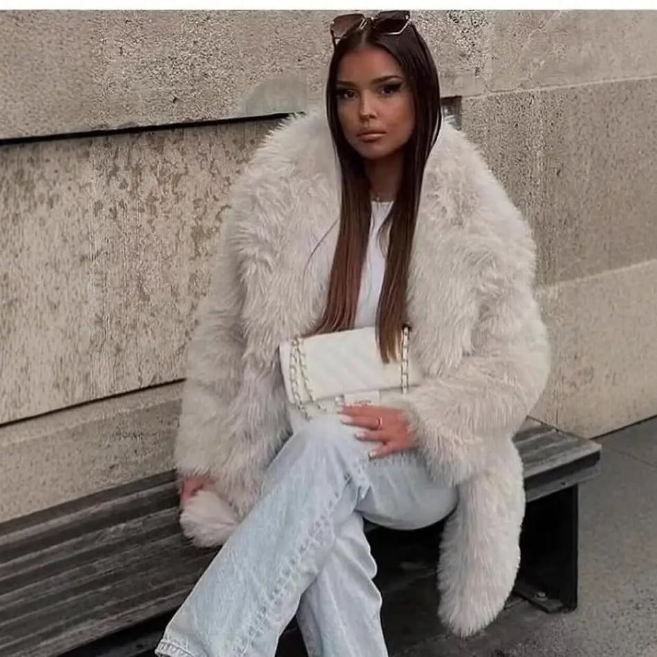 Woman in a fluffy white coat.