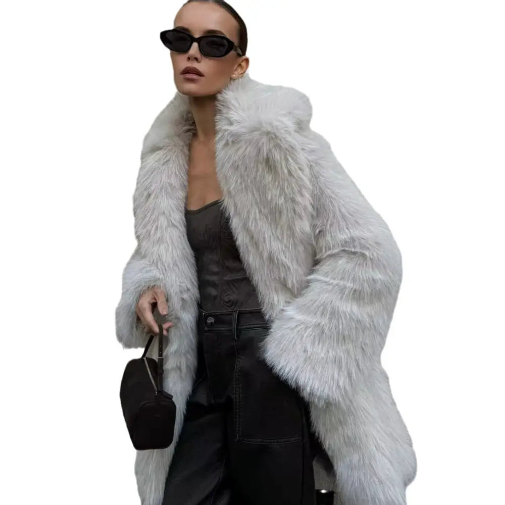 Woman in a long, white faux fur coat.