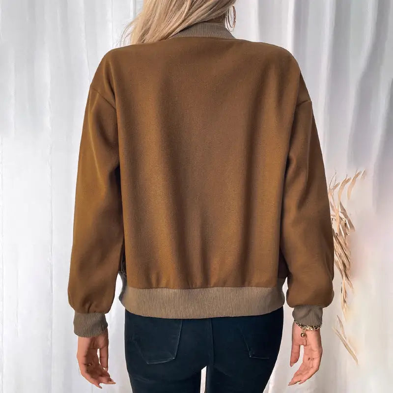 Brown bomber jacket.