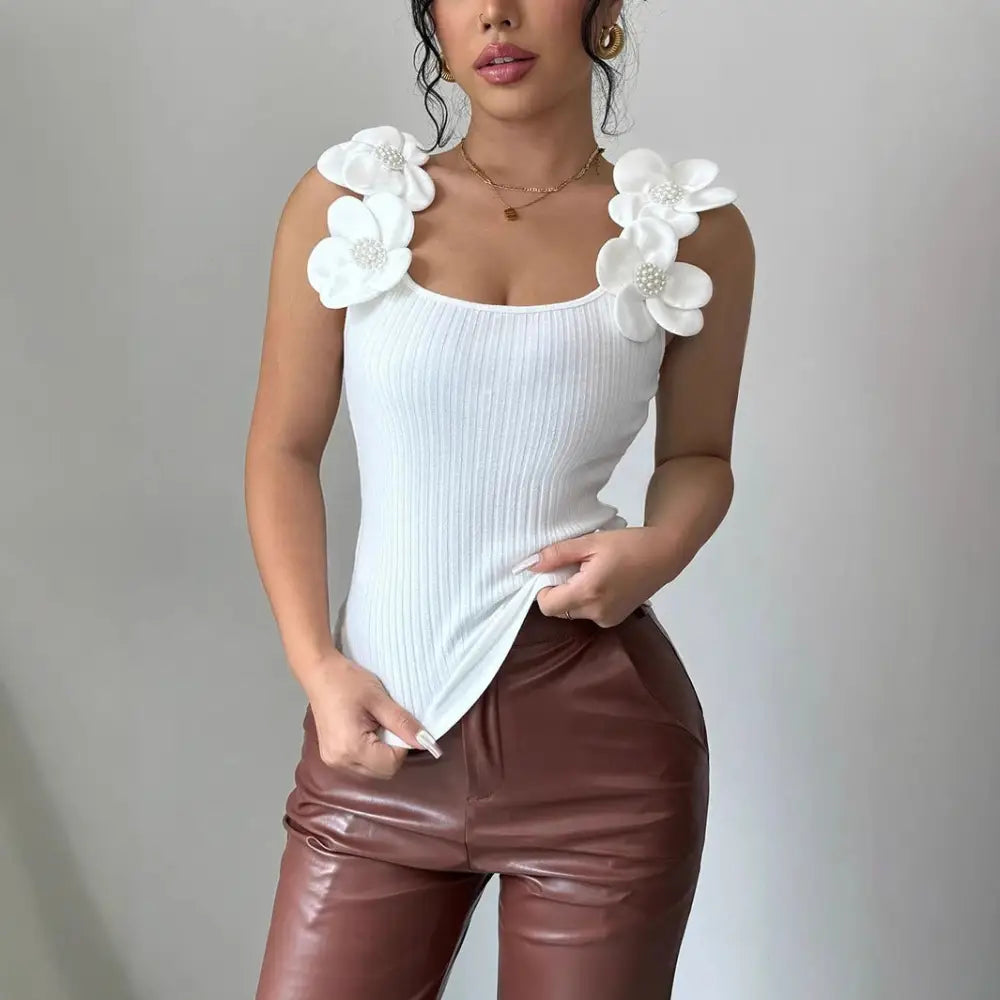 White floral-embellished ribbed tank top.