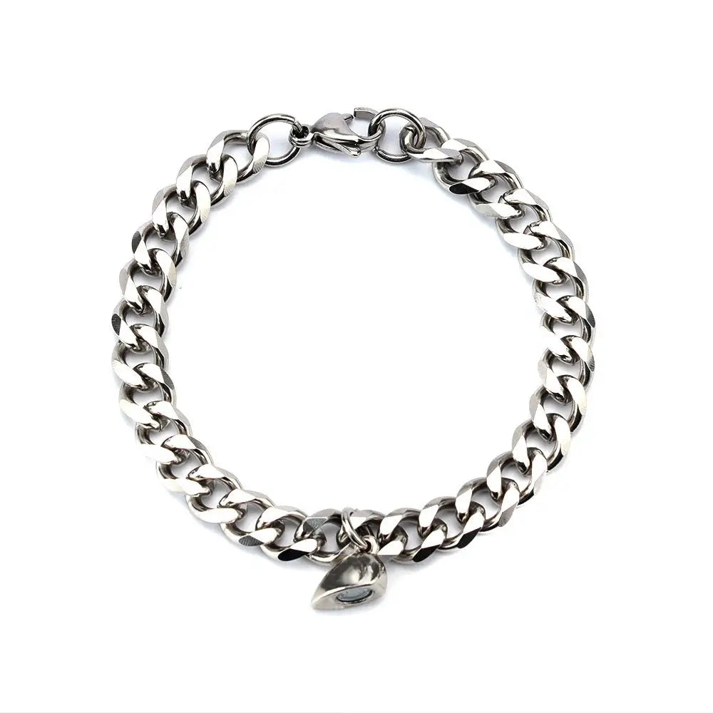 Silver chain bracelet with teardrop charm.