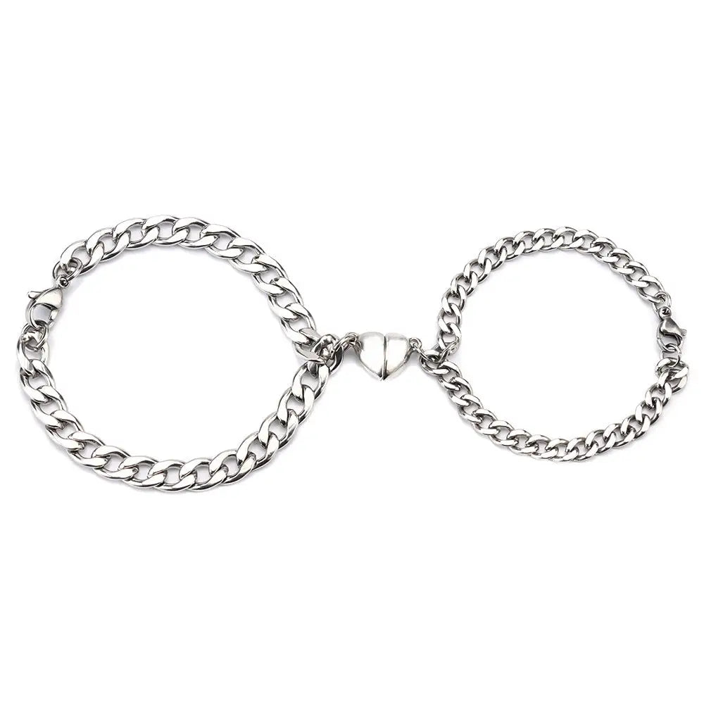 Two silver chain bracelets with magnetic heart clasp.