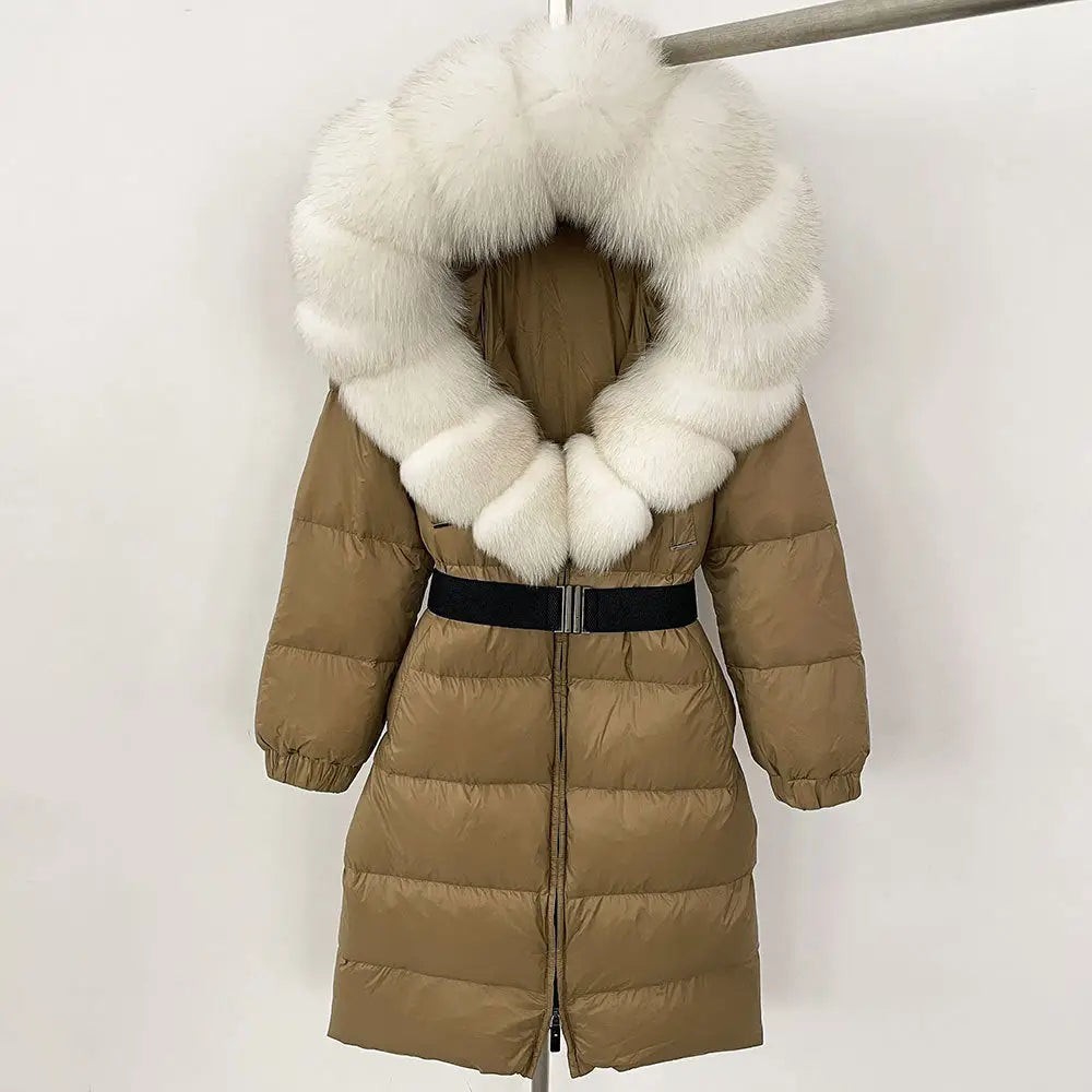 Tan puffer coat with white fur hood and black belt.