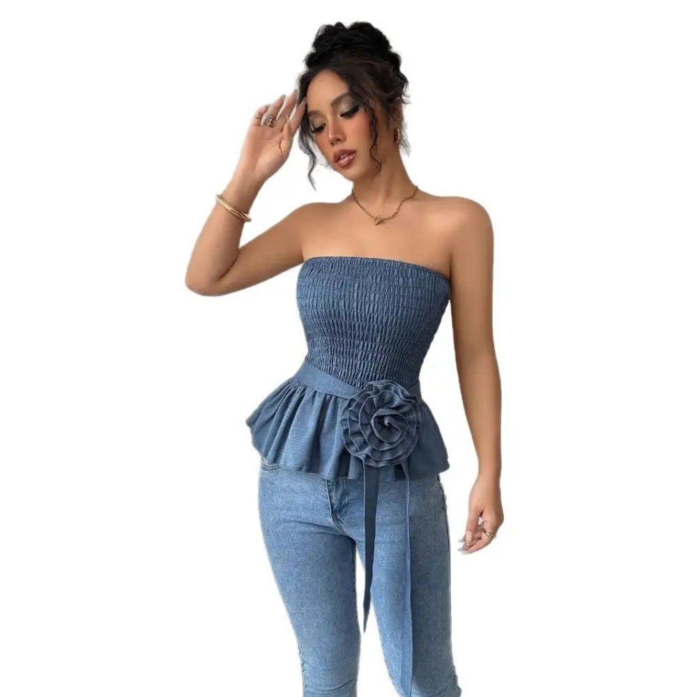 Woman in denim tube top and jeans.