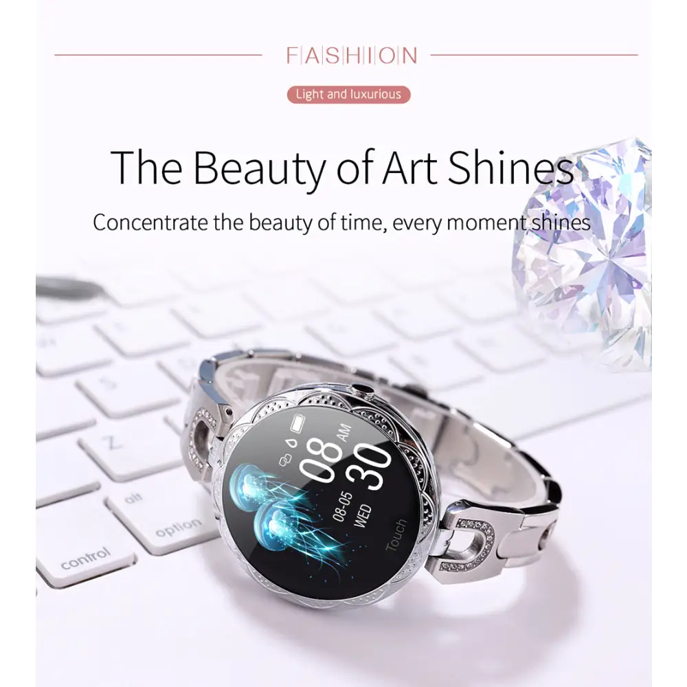 Silver smart watch with jeweled band.
