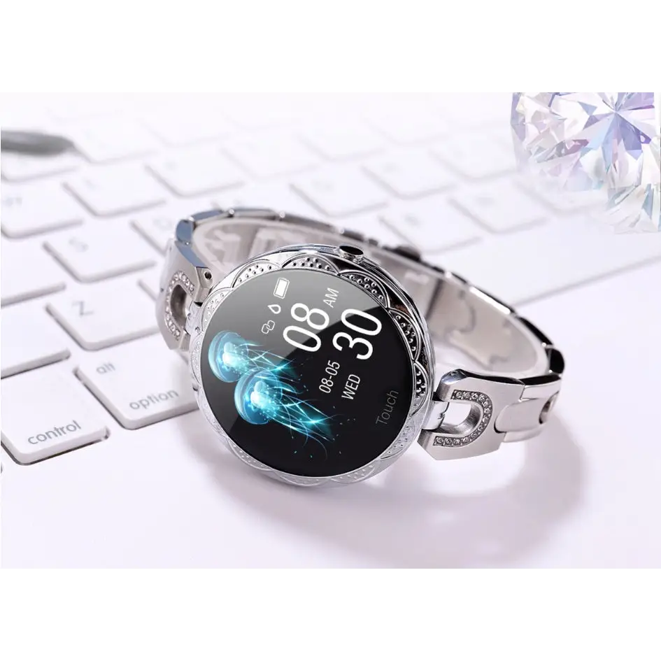 Silver jeweled smartwatch with jellyfish display.