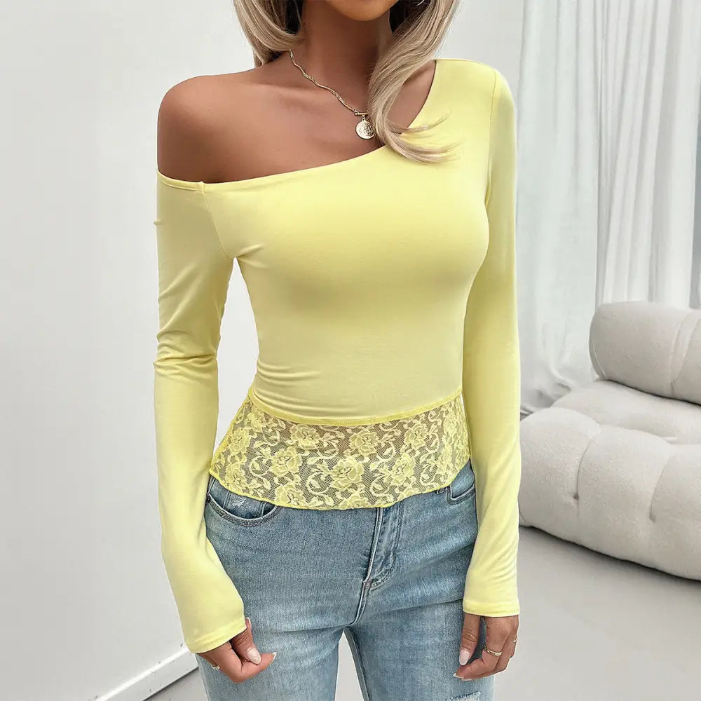 Yellow one-shoulder long-sleeve top with lace trim.