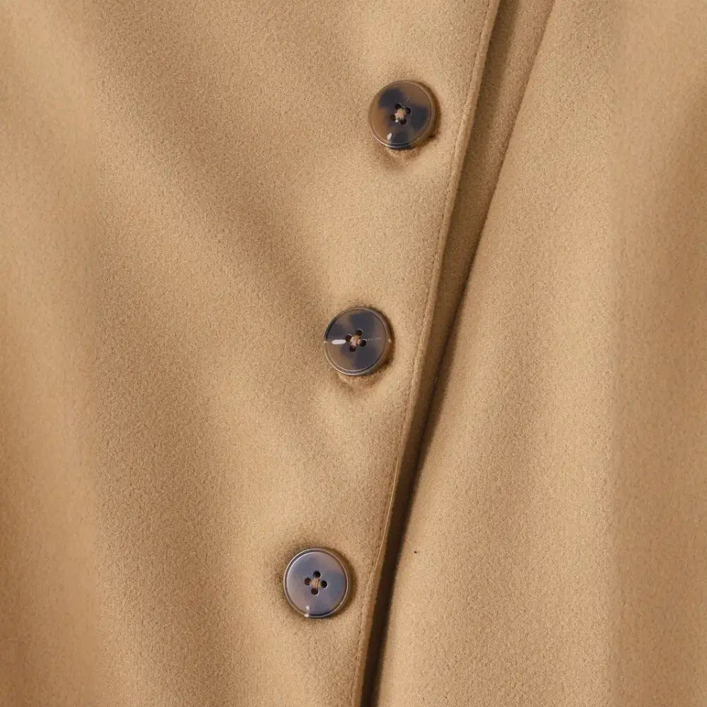 Tan fabric with buttons.