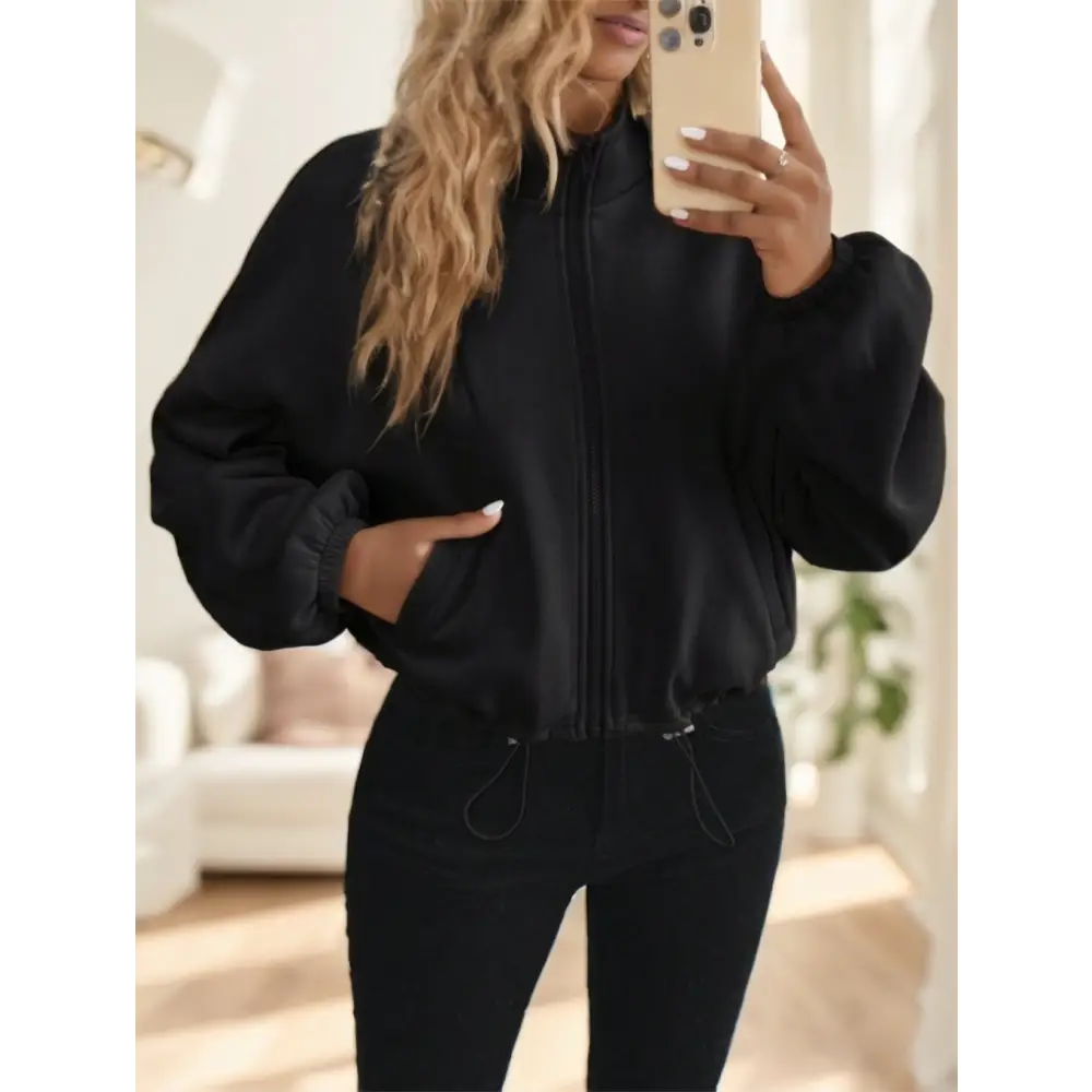 Black zip-up bomber jacket.