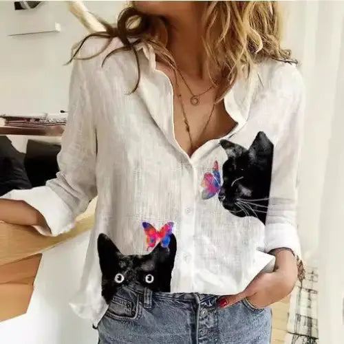 White cat-themed button-down shirt.