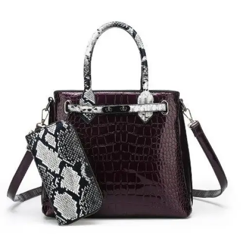 Burgundy crocodile-patterned handbag with snakeskin accents.