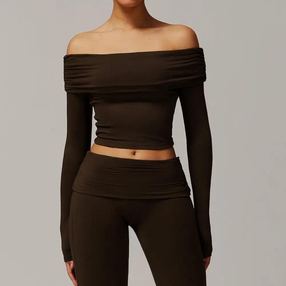 Dark brown off-the-shoulder crop top and leggings set.