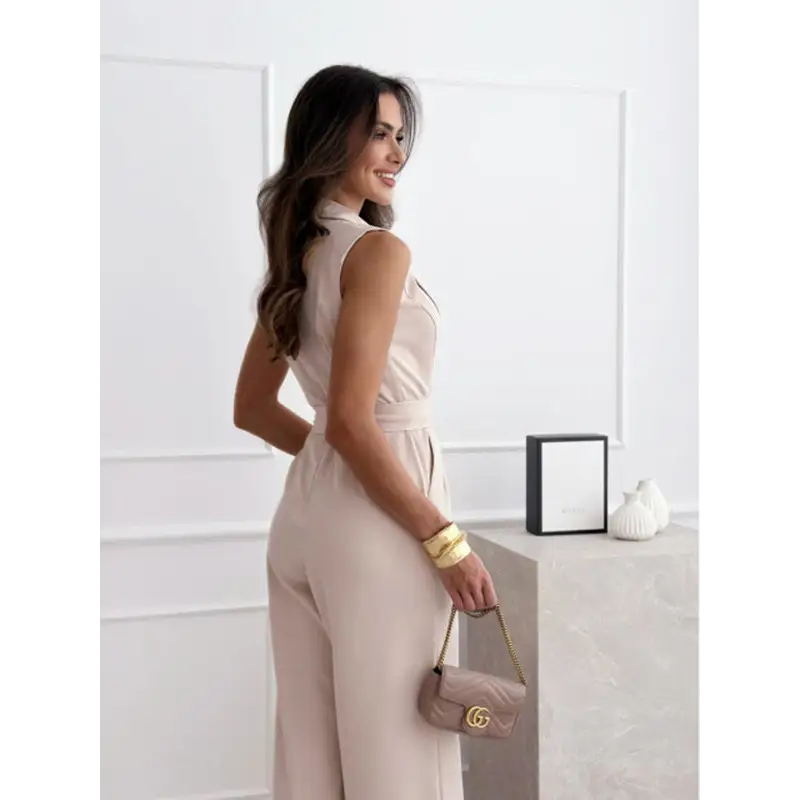 Beige sleeveless jumpsuit.