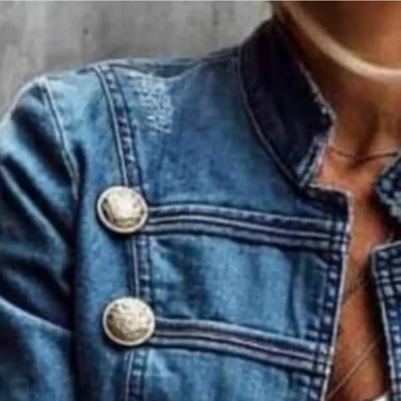 Blue denim jacket with decorative buttons.