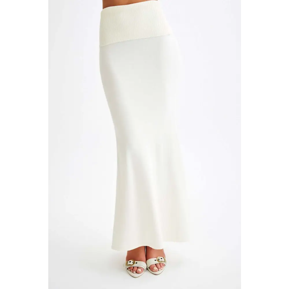Cream-colored knit maxi skirt.