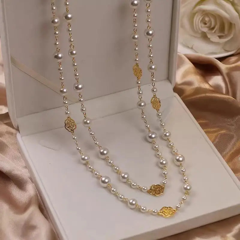 Elegant pearl and gold necklaces.