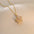 Fashion Rotating Bauhinia Zircon Necklace with Flower Design - LauBelle Brand
