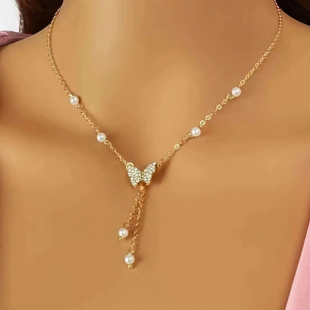 Butterfly Pearl Charm Necklace with Intricate Detailing - LauBelle
