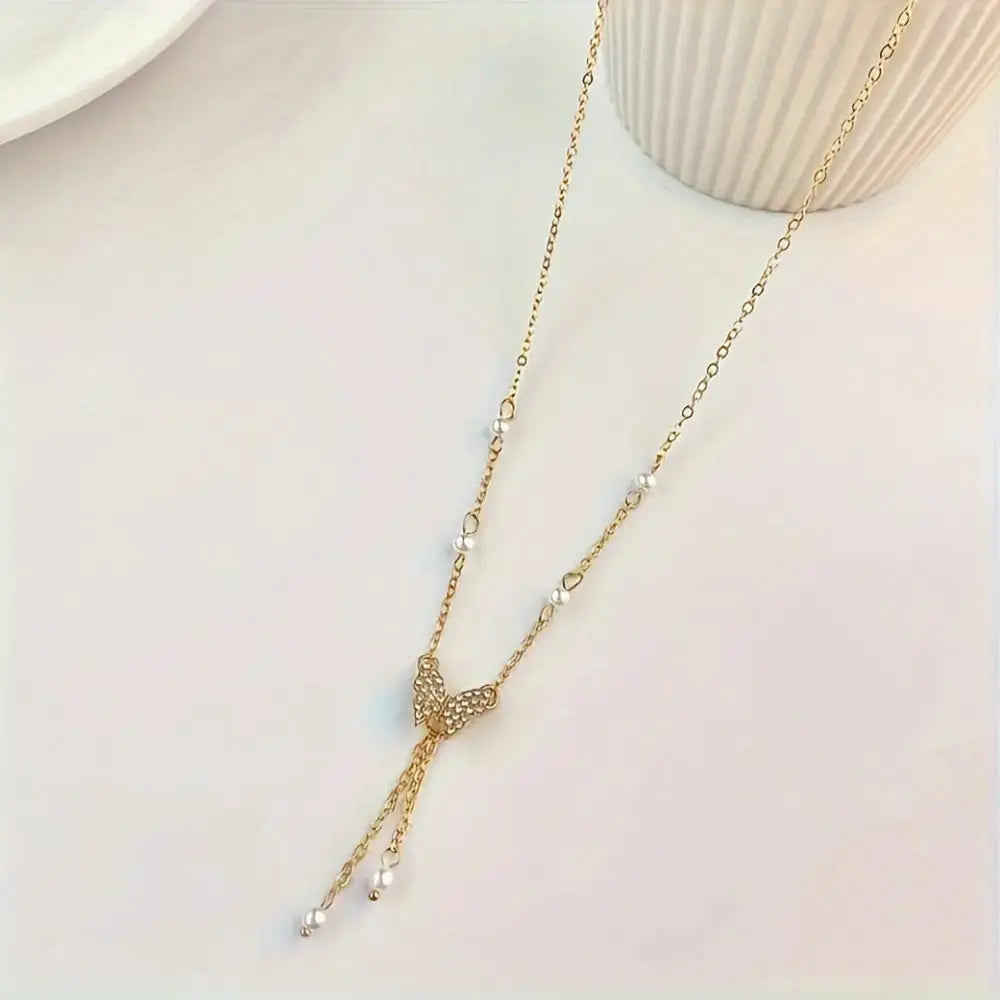 Butterfly Pearl Charm Necklace with Intricate Detailing - LauBelle