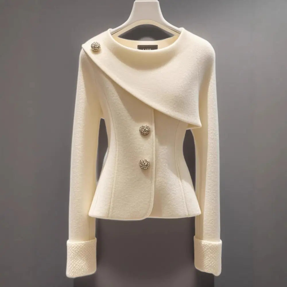 Cream-colored asymmetrical buttoned jacket.