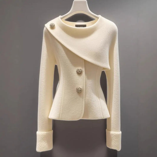 Cream-colored asymmetrical buttoned jacket.
