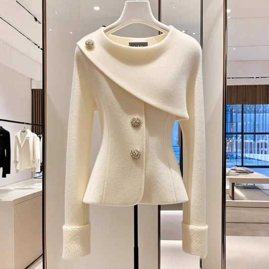 Elegant white wool jacket with decorative buttons.