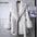 White faux fur coat with tie.