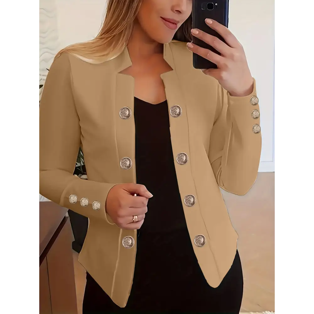 Tan blazer with decorative buttons.