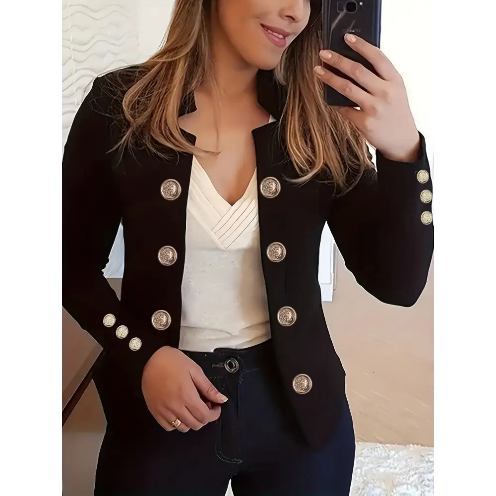 Black blazer with decorative buttons.