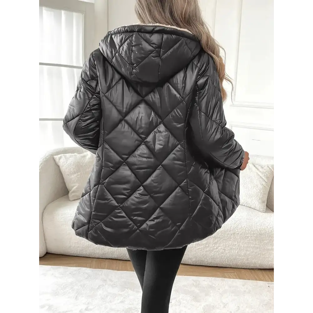 Black quilted hooded jacket.