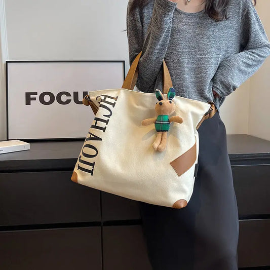 Canvas Shoulder Bag with Pendant and Ribbon Options