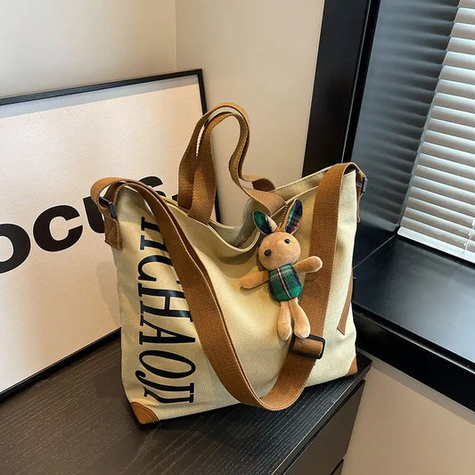 Canvas Shoulder Bag with Pendant and Ribbon Options