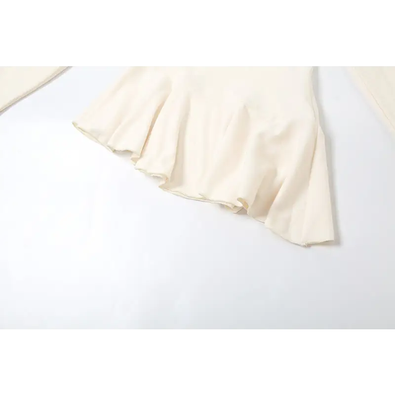Cream-colored ruffled fabric.
